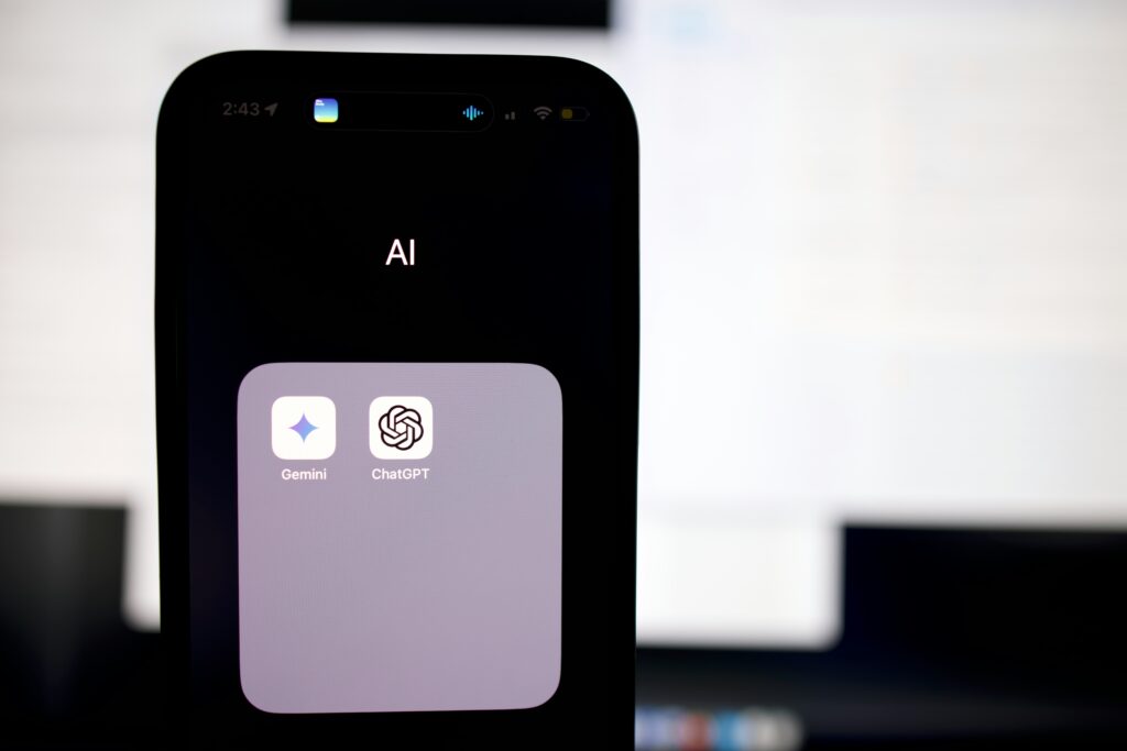 Smartphone displaying an AI button on its screen, symbolizing modern artificial intelligence technology.